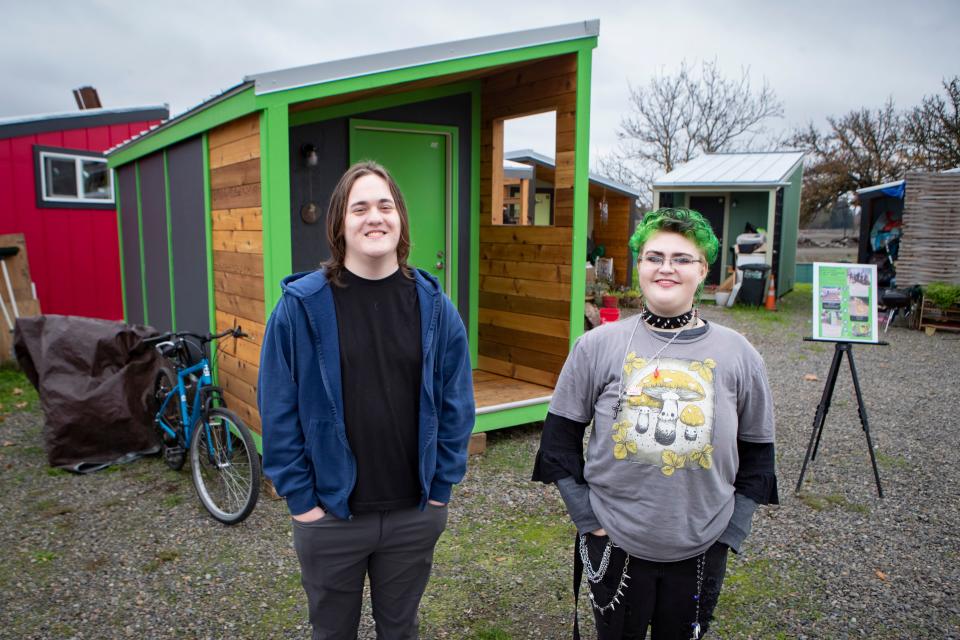 Looking Glass Riverfront students Keian Ridgeway, left, and Vyren Johnson were among a group of students in the school’s skilled trades program which constructed a new tiny home for Square One Villages’ Opportunity Village in Eugene.