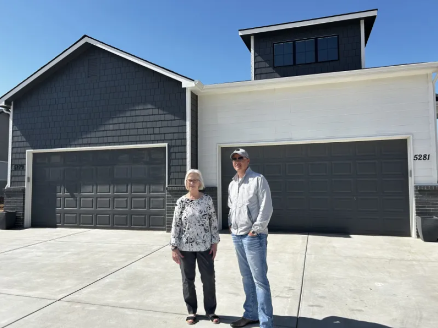 Jeff Torkelson, left, an owner of JCT Holdings, and Kit Corby, owner of The Corby Group, teamed up to build and market multi-family housing developments. They concluded two and a half years ago that high-end duplexes, like these in Bel Aire, could provide some homeowners an affordable alternative to new single-family homes.